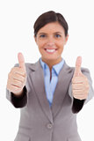 Close up of thumbs up given by female entrepreneur