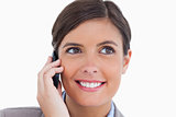 Close up of smiling female entrepreneur on her cellphone
