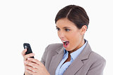 Close up of female entrepreneur surprised by text message