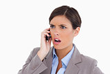 Close up of angry entrepreneur on her cellphone