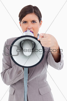 Close up of angry yelling entrepreneur with megaphone
