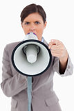 Close up of megaphone being used by angry entrepreneur