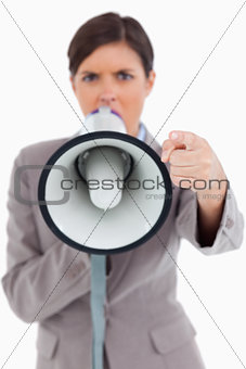 Close up of megaphone being used by angry entrepreneur