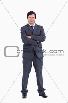Smiling tradesman with his arms folded