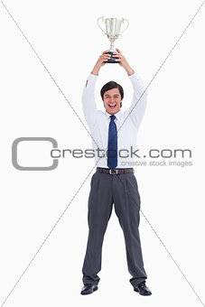 Successful tradesman holding cup