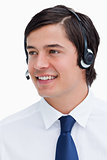 Close up of smiling male call center agent looking to the side