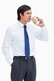 Tradesman drinking coffee out of a paper cup