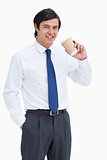 Smiling tradesman with paper cup