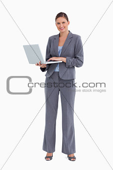 Smiling tradeswoman with her notebook