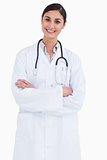 Smiling female doctor with arms folded
