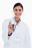 Stethoscope being used by smiling female doctor