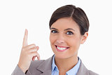 Close up of smiling female entrepreneur pointing up