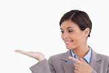 Close up of female entrepreneur looking and pointing at her palm