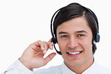 Close up of smiling male call center agent in a conversation