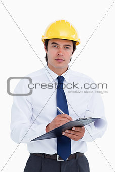 Male architect with clipboard and pen