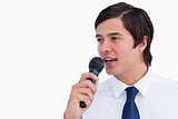 Close up side view of young tradesman with microphone