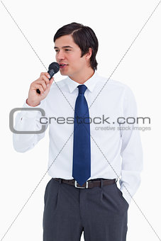 Close up of young tradesman talking with microphone