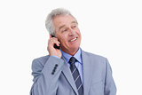 Close up of mature cheerful tradesman on his cellphone