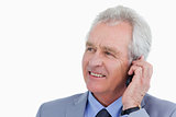 Close up of mature tradesman talking on his mobile phone