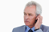 Close up of mature tradesman listening to caller