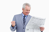Mature tradesman cheering about news paper article