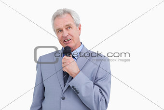 Mature tradesman with microphone