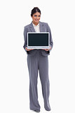 Smiling female entrepreneur presenting screen of her laptop