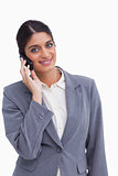 Smiling female entrepreneur on her cellphone