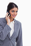 Smiling female entrepreneur on her mobile phone