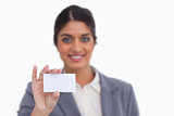 Smiling female entrepreneur showing her business card