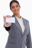 Blank business card being shown by female entrepreneur