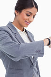 Close up of female entrepreneur looking at watch