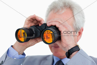 Close up of tradesman looking through binoculars