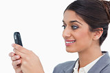 Close up side view of female entrepreneur reading text message