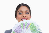 Close up of smiling female entrepreneur with money