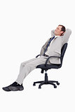 Side view of businessman leaning back in his chair