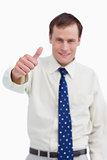 Close up of thumb up being given by businessman