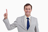 Close up of smiling businessman pointing up