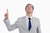 Close up of businessman pointing and looking up