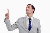 Close up of businessman looking and pointing up
