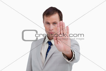 Close up of businessman signalizing stop