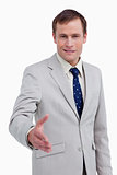 Smiling businessman offering his hand