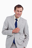 Smiling businessman standing with hand in his pocket