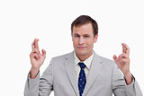 Close up of businessman with his fingers crossed
