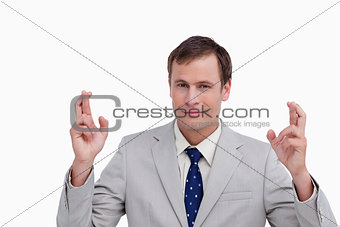 Close up of businessman with his fingers crossed