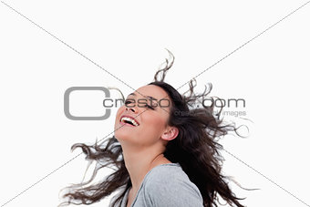 Smiling woman flipping her hair