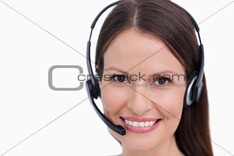 Close up of smiling female call center employee