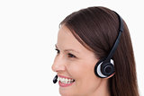 Close up side view of smiling female call center agent