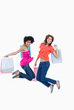 Young teenagers energetically jumping after going shopping