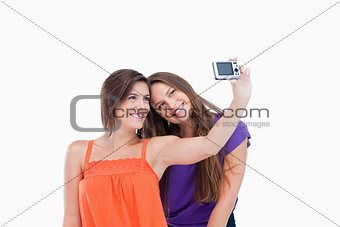 Teenage girl laying her head on her friend's shoulder
